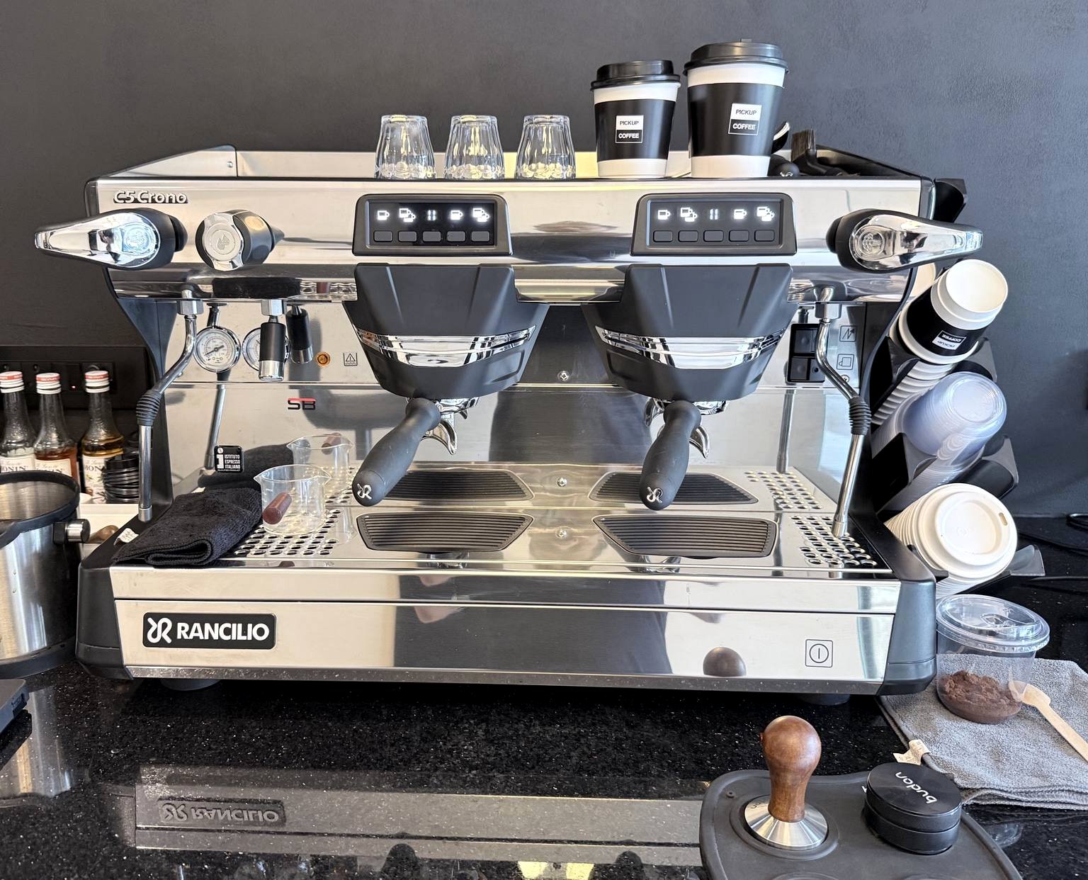 Our espresso bar — a Rancilio machine with branded Pickup Coffee cups
